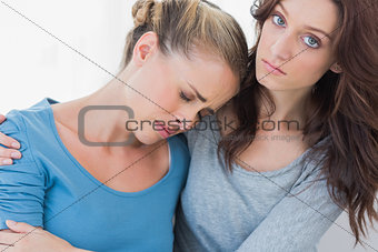Woman consoling her upset friend