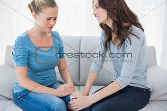 Woman consoling her crying friend