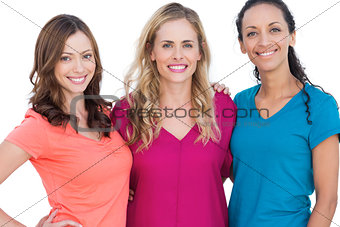 Happy models posing with colorful t shirts