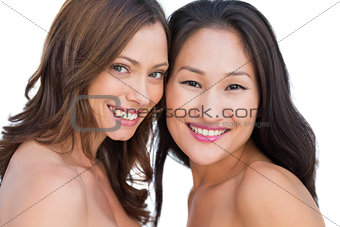 Smiling beautiful nude models posing together