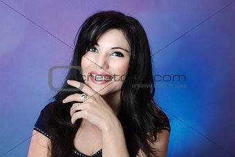 Beautiful woman with glossy black hair and big happy smile