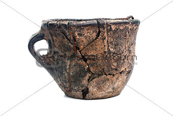 Old cracked ceramic cup