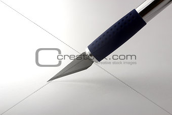 Sharp razorblade cutting paper