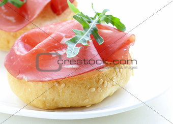 sandwich with smoked beef (bresaola) on  bun with sesame seeds