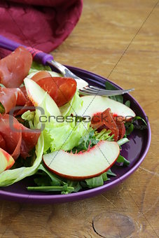 gourmet salad with peaches and bresaola (smoked beef)