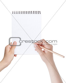 female teen hands writing something in notepad