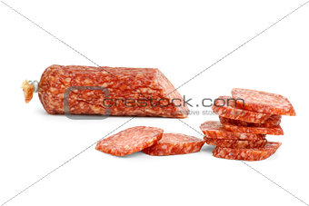 Half of salami sausage and slices near