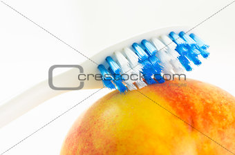 Toothbrush on fruit