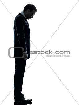 sad business man  looking down silhouette