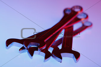 wrenches in red light