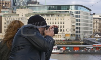 Couple taking pictures of London