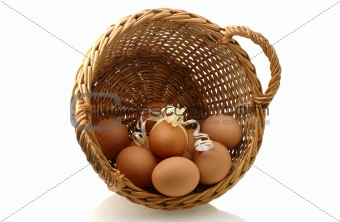  few eggs in basket with one decorated