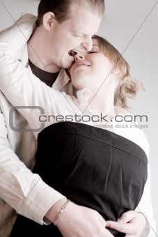 Portrait of a young biting loving couple