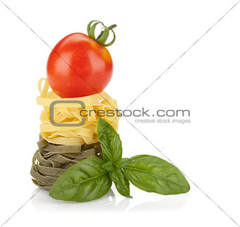 Fettuccine nest pasta with tomato cherry and basil