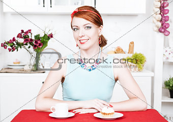 Beautiful smiling woman on the kitchen