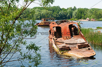 Wrecked abandoned ship on a river
