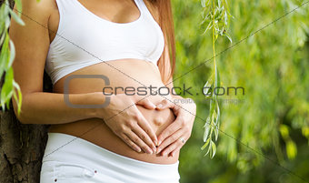 Heart on a pregnant woman's belly