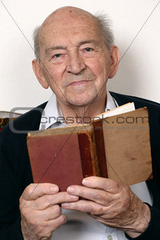 Portrait of a senior man reading a book