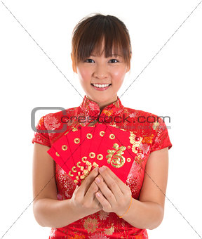 Chinese cheongsam girl holding red packets