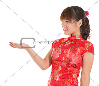 Chinese cheongsam girl showing empty palm
