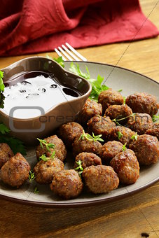 meatballs - traditional meat dish with sauce and herbs