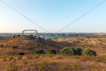 Rural landscape with grassland and a lake