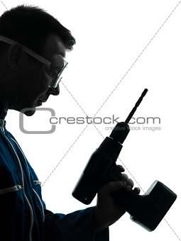 man construction worker holding drill silhouette