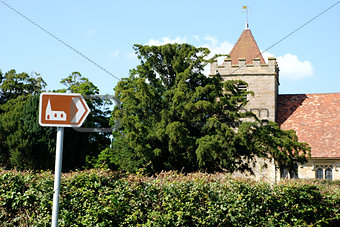 Tourist sign points towards historic church