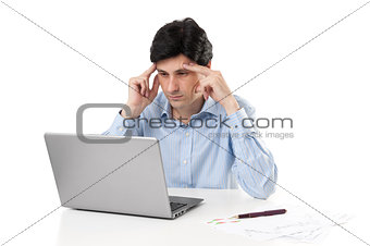 pensive businessman working on laptop