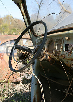 Rusty car at junkyard