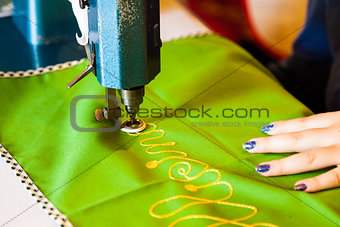 Lady hand at sewing