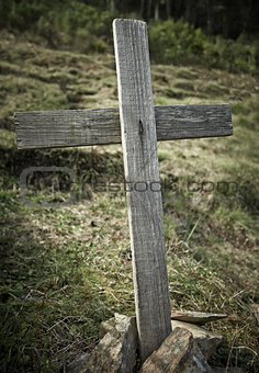 Old wooden crossed on a hill
