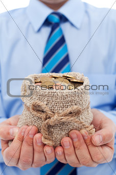 Businessman holding a bag of euro coins