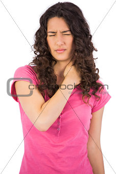 Young attractive brunette with painful neck
