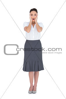 Shocked gorgeous businesswoman posing