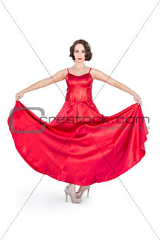 Gorgeous flamenco dancer holding her red dress