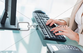 Close up of a businesswoman using a keyboard