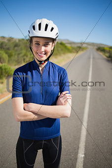 Woman with helmet crossing arms