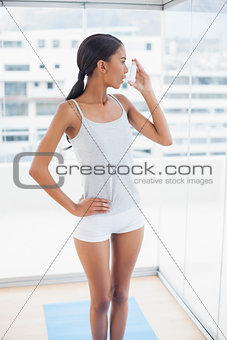 Beautiful model using her asthma atomizer