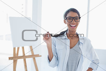 Smiling attractive artist posing