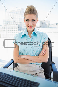 Happy classy businesswoman crossing arms