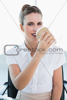 Stylish businesswoman drinking coffee