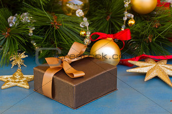 x-max gift box under fir tree