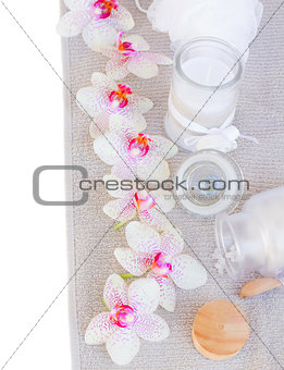 spa settings with pink orchideas and aroma candle