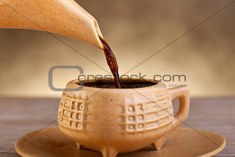 Coffee pouring into cup