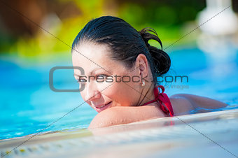 Portrait of happy girl in pool