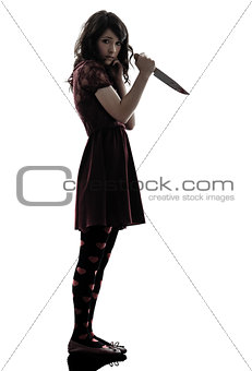 strange young woman killer holding  bloody knife silhouette