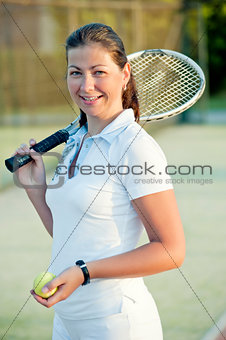 Young happy girl with a tennis racket