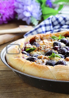 homemade pie  (galette) with grapes and blue cheese