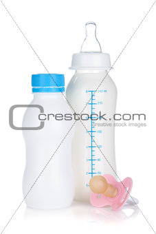 Baby yoghurt, milk bottle and pacifier